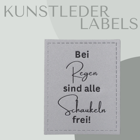 reflektierendes Kunstleder Label eckig mit der Aufschrift "bei Regen sind alle Schaukeln frei" in silber