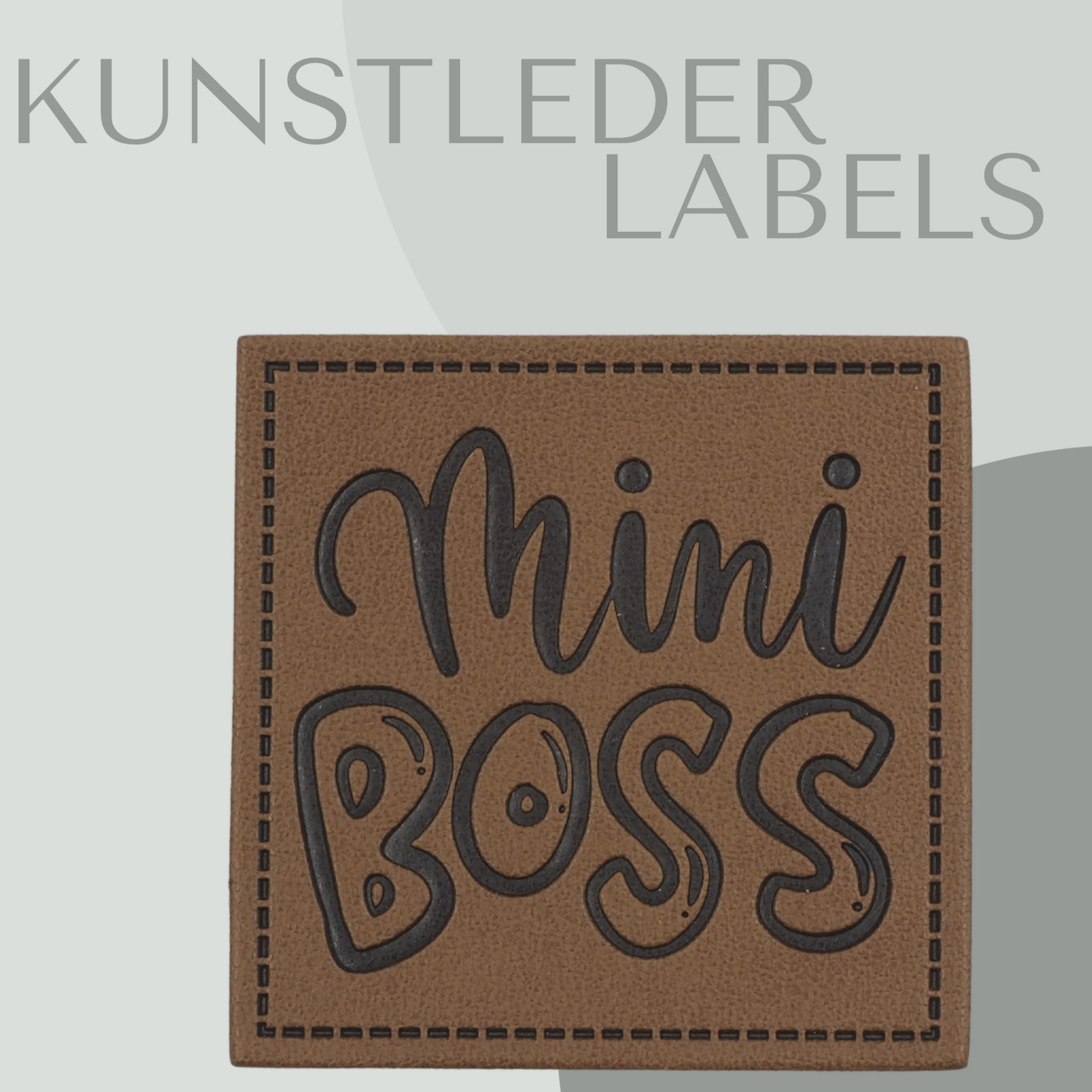 Kunstleder Label eckig in braun mit der Aufschrift "mini boss"