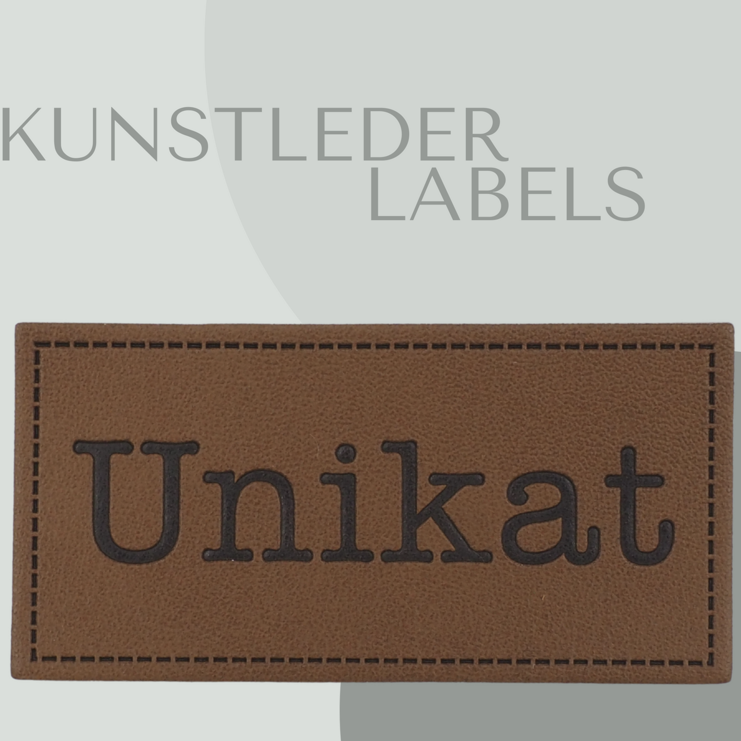 Kunstleder Label eckig in braun mit der Aufschrift "Unikat"